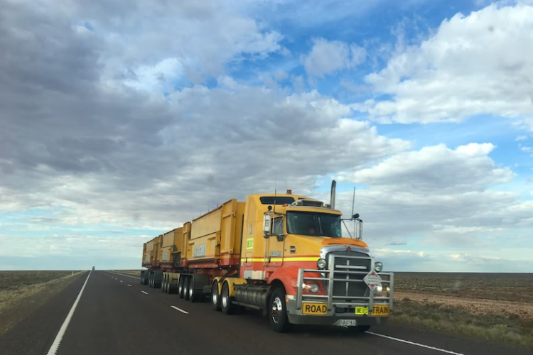 Truck driving down empty highway